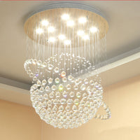 Lustre Sphère Cristal Argenté Salon allumé ambiance