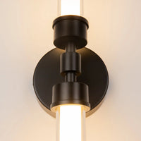 Applique murale LED verticale installée près d'une tête de lit