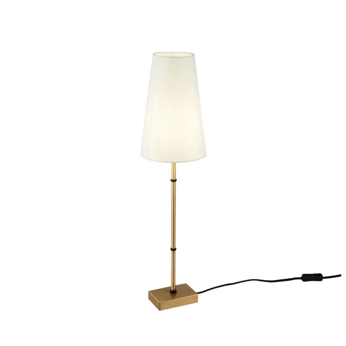 Lampe de chevet dorée posée sur une table de nuit cosy