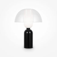 Lampe de chevet céramique noire posée sur console d'entrée élégante