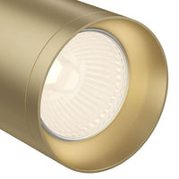 Applique murale orientable dirigeant un faisceau lumineux vers un tableau.