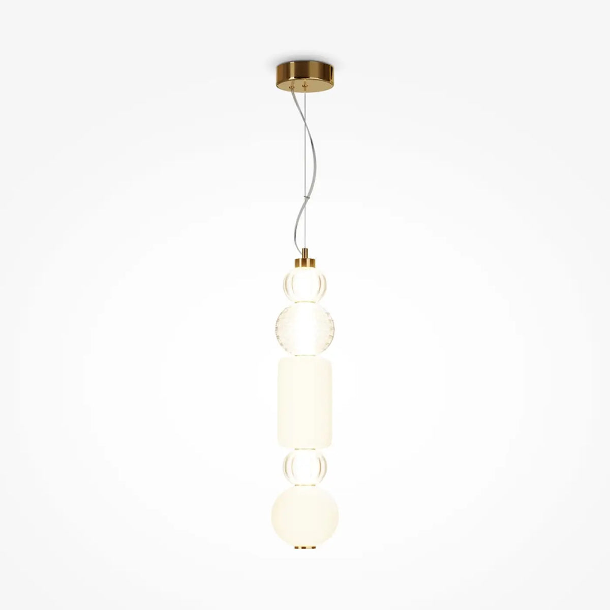 Suspension à globes en verre éclairée diffusant une lumière blanc chaud