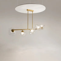 Détail des cinq diffuseurs de la suspension linéaire dorée vintage