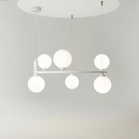 Suspension à globes noire éclairant une salle à manger conviviale, vue 20