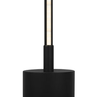 Lampadaire LED tube noir installé près d'un canapé contemporain